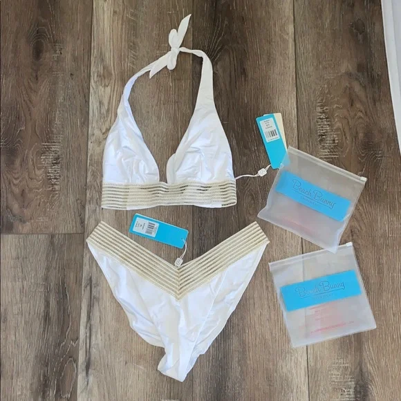NWT Beach Bunny White and Gold Bikini 2 piece set
Halter top (L)
Bottoms (XL) - Picture 3 of 9